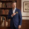 Sartorial menswear: tailored navy blazer styled with a fine art silk scarf folded as a pocket square from ArAr Gallery